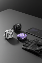 Heavy Bass Wireless Earbuds chrome charging case on minimal dark desk with gym gear